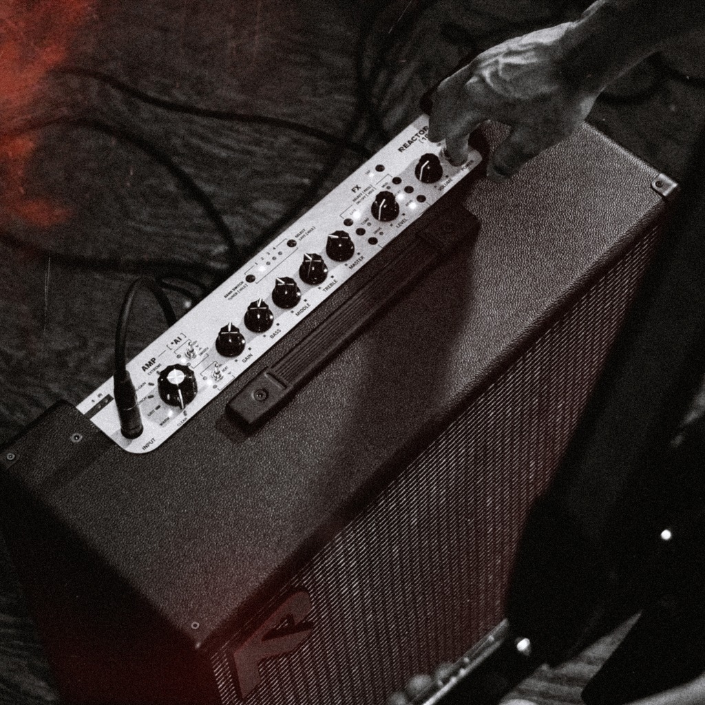 REACTOR's top control panel showing the Amp Selector knob, Gain, Bass, Middle, Treble and Master controls, the FX section, and onboard preset buttons