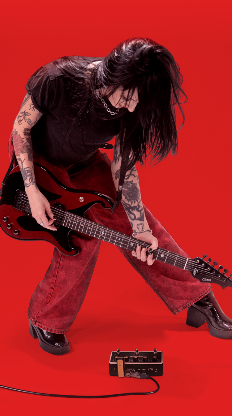 Guitarist leaning into a riff with Spark PEDAL on the floor