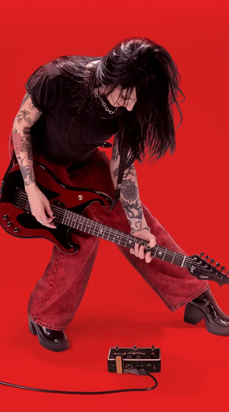 Guitarist leaning into a riff with Spark PEDAL on the floor